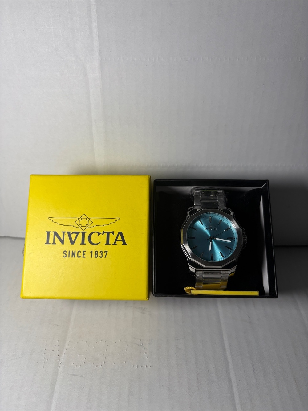 Invicta Silver Watch with Teal Blue Sunburst Dial